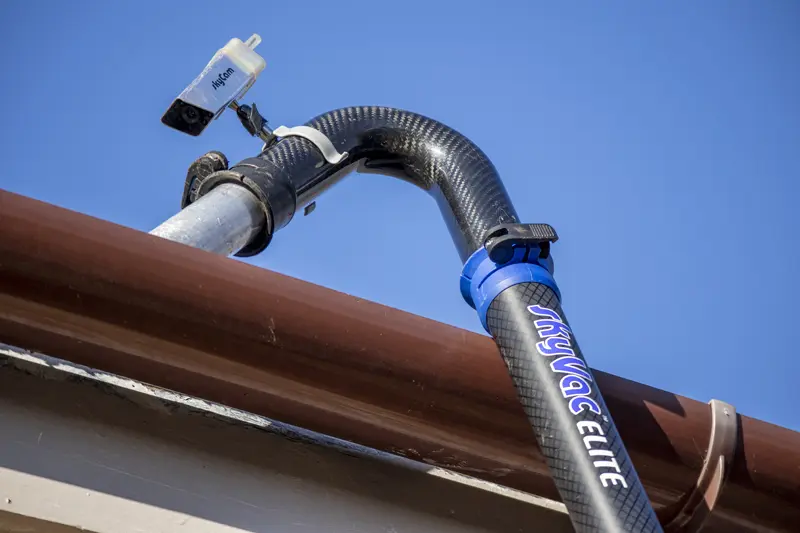 Crystal Clean Windows using the SkyVac Elite system with a SkyCam wireless camera to safely clear high-level gutters in Parson Drove Wisbech.