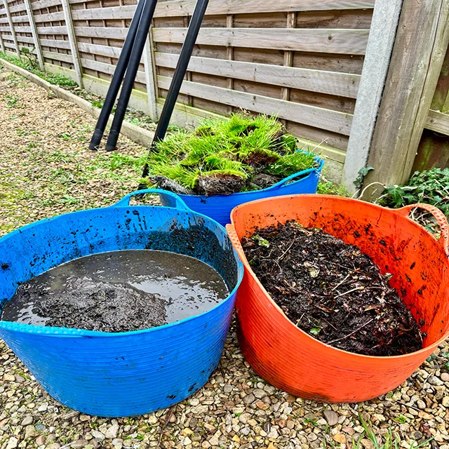 Gutter waste and moss clearance by Crystal Clean Windows, demonstrating a thorough gutter vacuuming service.